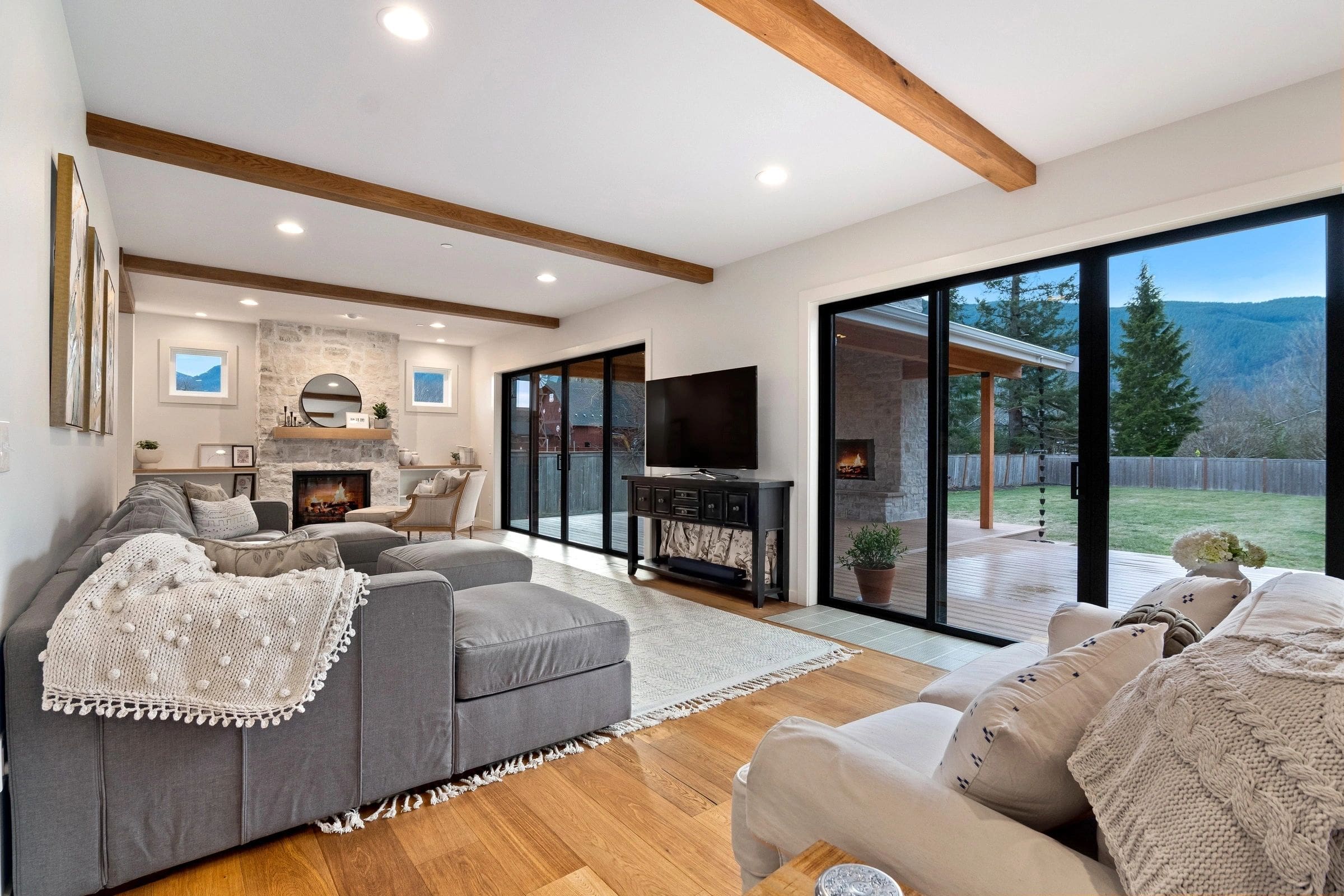 A living room with couches and a television.