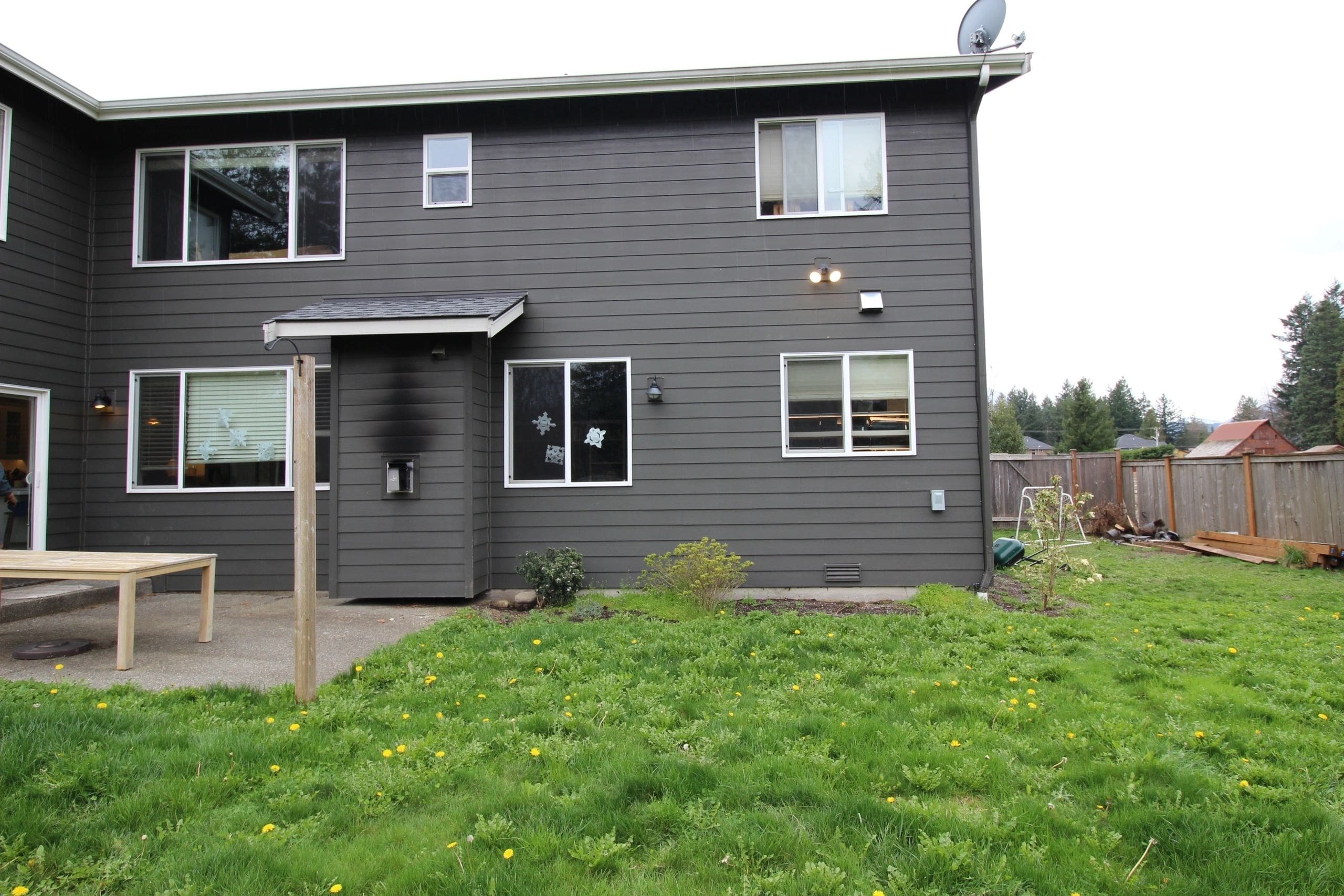 A house with a green lawn and some grass