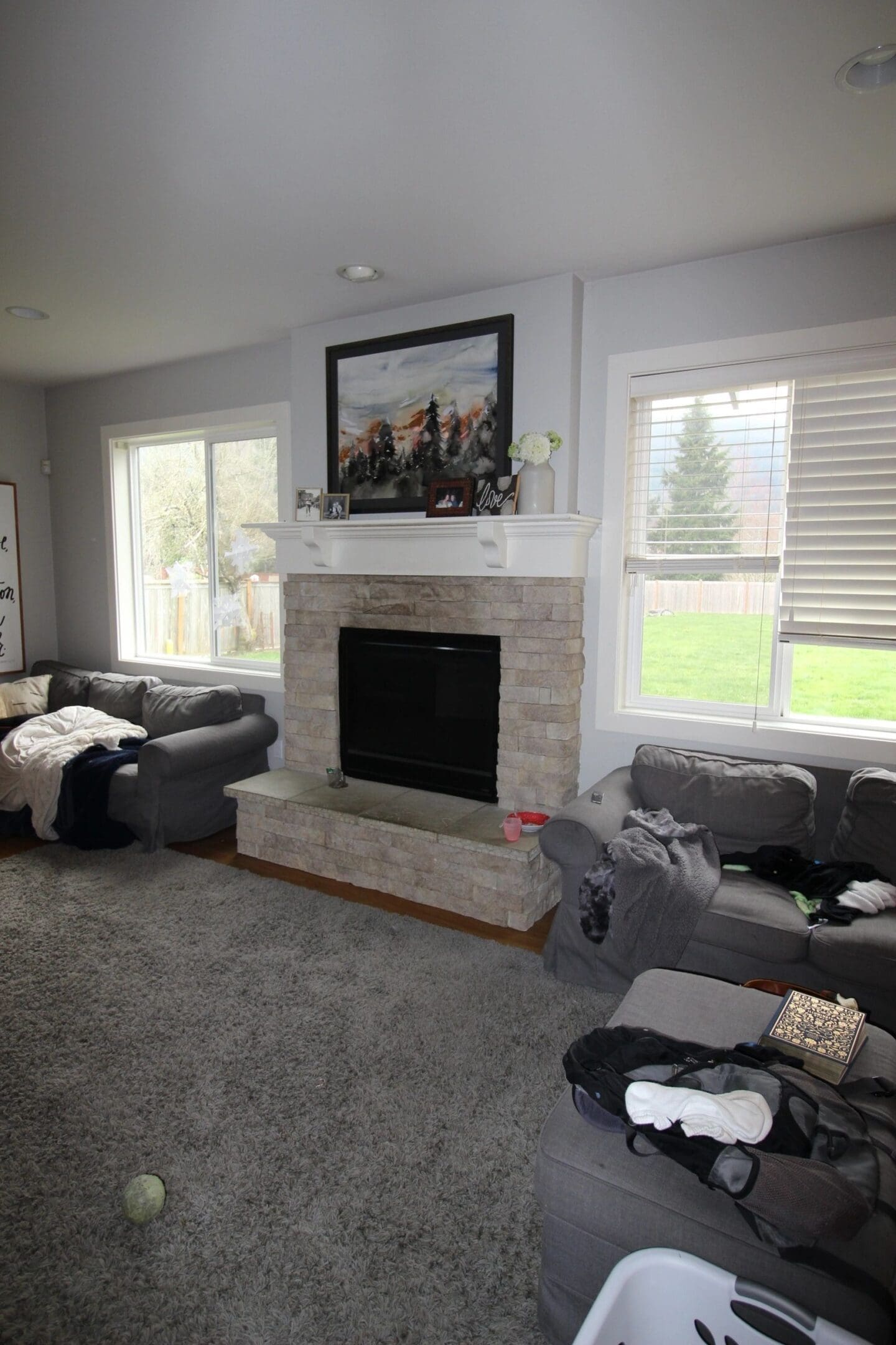 A living room with couches and a fireplace