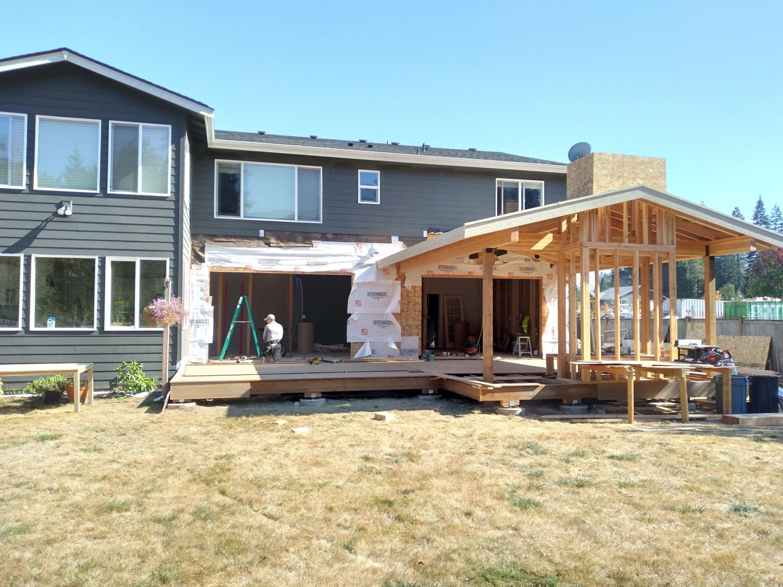 A house being built with some wood and other materials.