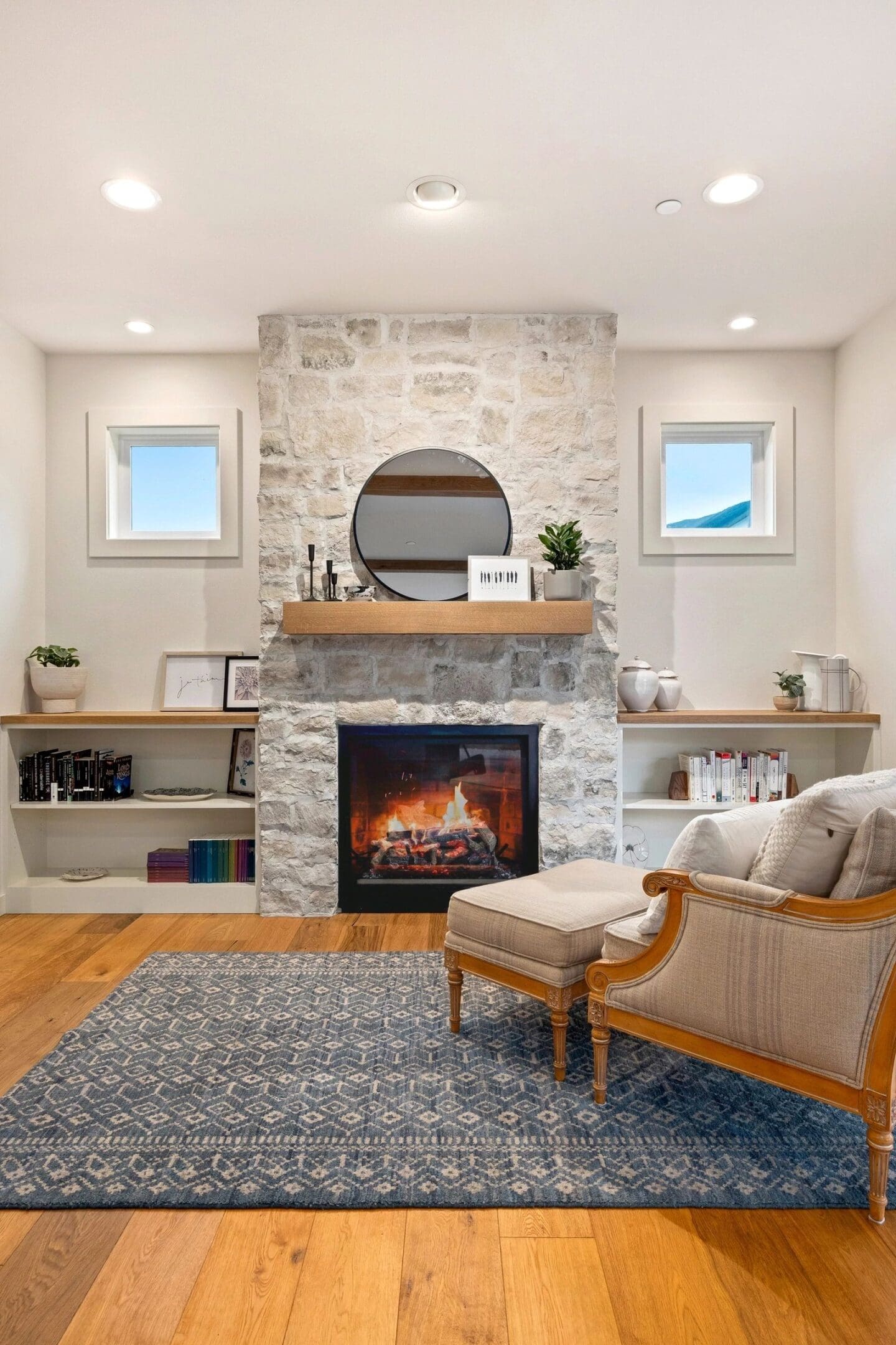 A living room with a fireplace and a chair